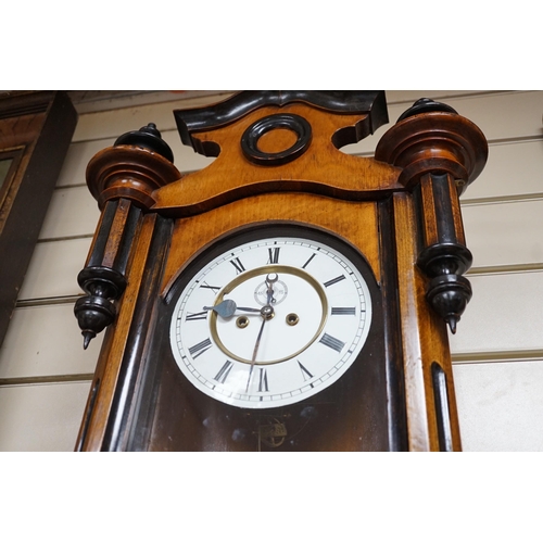 325A - A late 19th century walnut and ebonised Vienna wall clock, height 118cm *Please note the sale commen... 