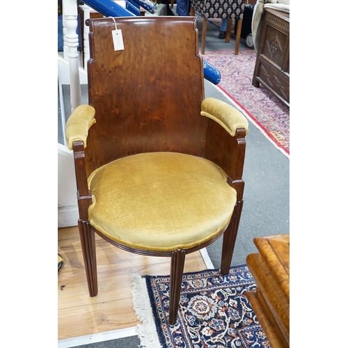 335A - A stylish Art Deco mahogany elbow chair by Trollope and Son, numbered 4088, height 95cm *Please note... 