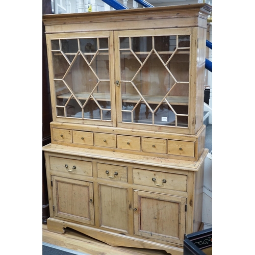 336 - A 19th century pine dresser base of small proportions with an associated glazed cabinet top, width 1... 