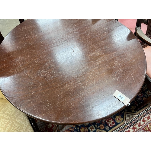 34 - A George III circular mahogany tilt top tripod tea table, diameter 84cm, height 70cm *Please note th... 