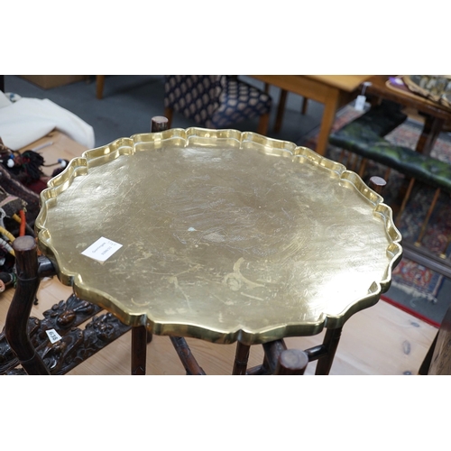 340 - A Chinese brass tray topped hongmu folding occasional table, diameter 56cm *Please note the sale com... 