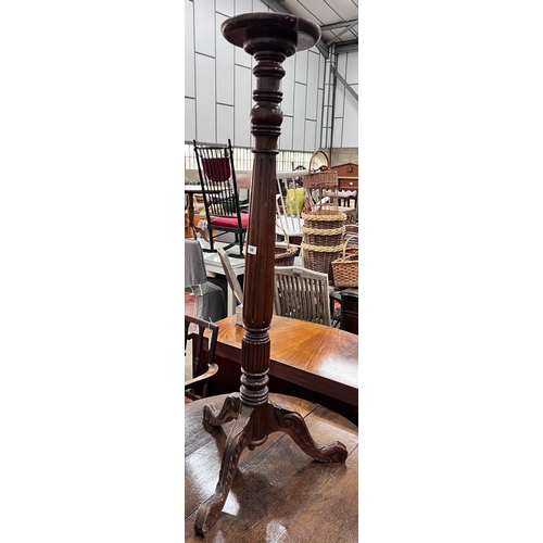 36 - A George III style mahogany torchere, height 131cm *Please note the sale commences at 9am.