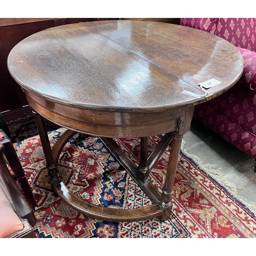 37 - A late 17th century oak D shape folding tea table, diameter 94cm, height 70cm *Please note the sale ... 