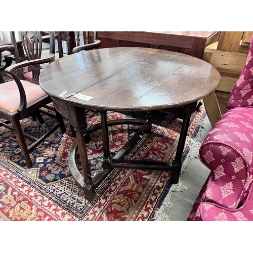 37 - A late 17th century oak D shape folding tea table, diameter 94cm, height 70cm *Please note the sale ... 