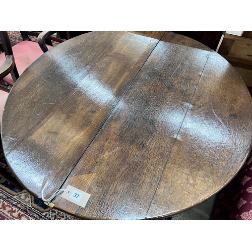 37 - A late 17th century oak D shape folding tea table, diameter 94cm, height 70cm *Please note the sale ... 