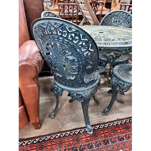 41 - A Victorian style circular aluminium table, diameter 80cm, height 69cm and four matching chairs *Ple... 