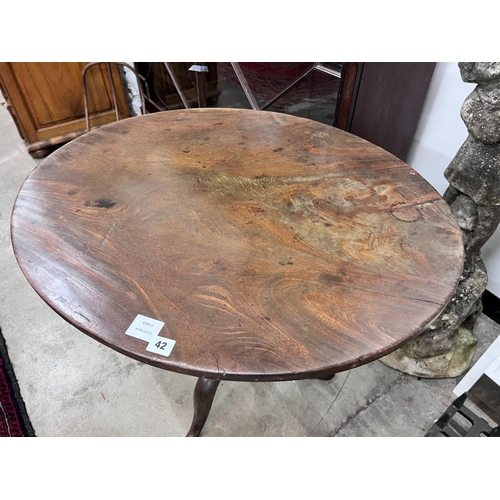 42 - A George III oval top tilt top tripod tea table, width 79cm, depth 65cm, height 71cm *Please note th... 