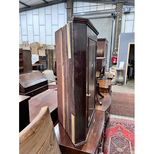 45 - A George III oak hanging corner cupboard, width 69cm, depth 40cm, height 97cm *Please note the sale ... 