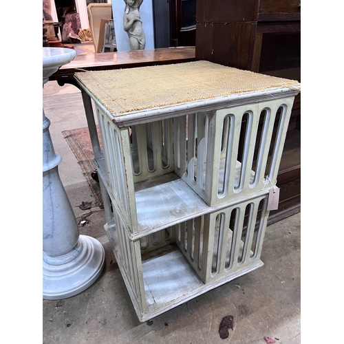 53 - A painted revolving bookcase, width 47cm, height 73cm *Please note the sale commences at 9am.