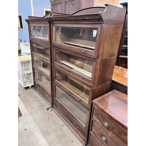 54 - A pair of Edwardian two tier oak Lebus four section bookcases, width 89cm, depth 36cm, height 166cm ... 