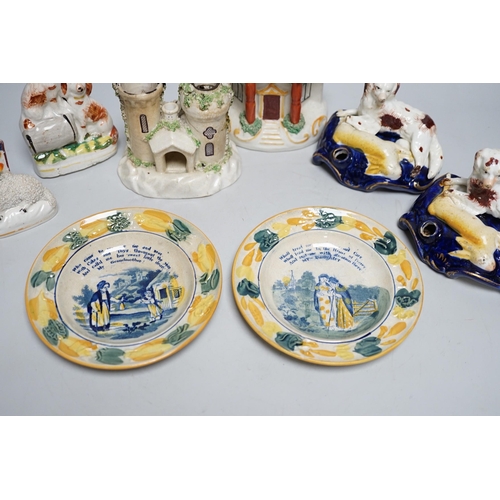 568A - A pair of 19th century Staffordshire King Charles Spaniel pen holders and two pearl ware plates etc ... 