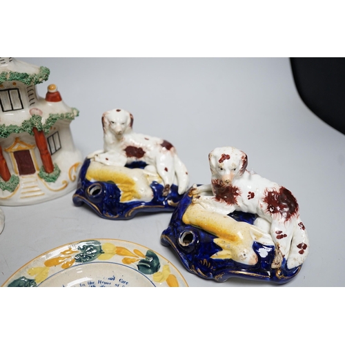 568A - A pair of 19th century Staffordshire King Charles Spaniel pen holders and two pearl ware plates etc ... 