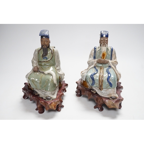 569 - Two Shiwan stoneware figures of the Jade Emperor and Lu Dongbin, losses, 19cm