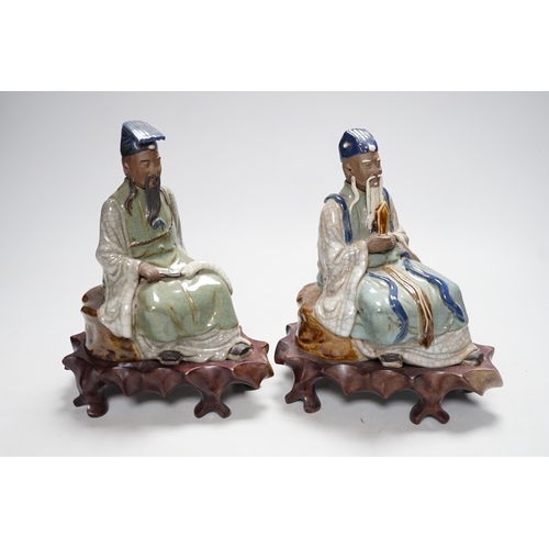 569 - Two Shiwan stoneware figures of the Jade Emperor and Lu Dongbin, losses, 19cm