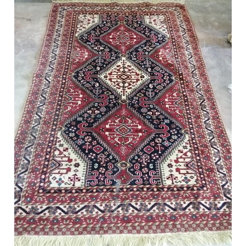 60 - A Caucasian style red ground rug, 214 x 130cm *Please note the sale commences at 9am.