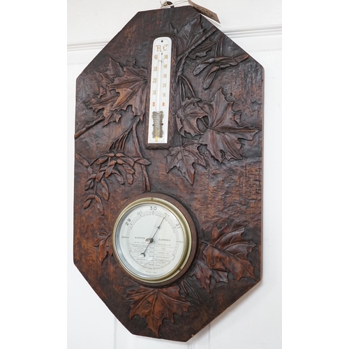 628A - A French carved wood aneroid barometer, 60 x 36cm