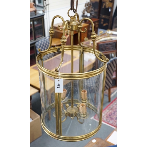 639 - A four light brass hall lantern, 62cm tall