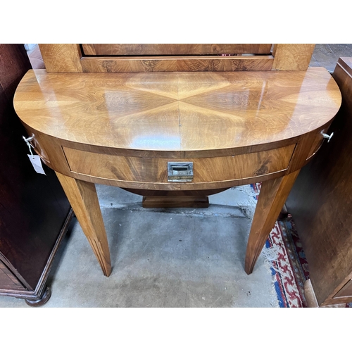 64 - An Art Deco walnut D shaped dressing table, width 100cm, depth 45cm, height 122cm *Please note the s... 