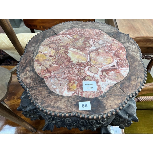 68 - A Chinese carved hardwood rouge marble-topped jardiniere stand, diameter 43cm, height 46cm *Please n... 