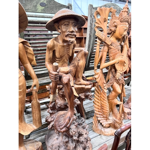 85 - Six Balinese carved hardwood figures, largest height 104cm *Please note the sale commences at 9am.... 