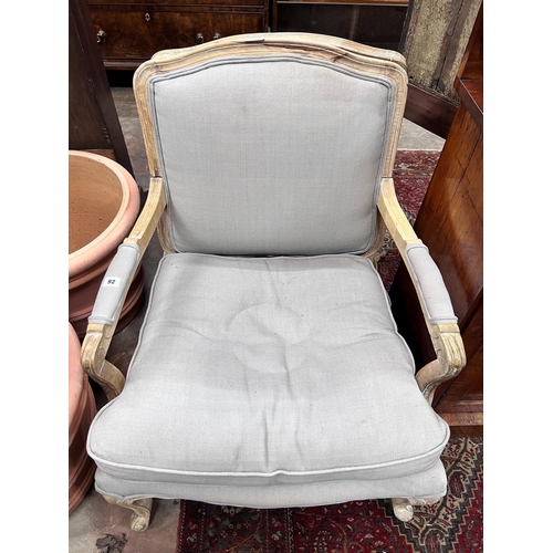 92 - A pair of Louis XVI style upholstered open armchairs, width 68cm, depth 70cm, height 88cm *Please no... 