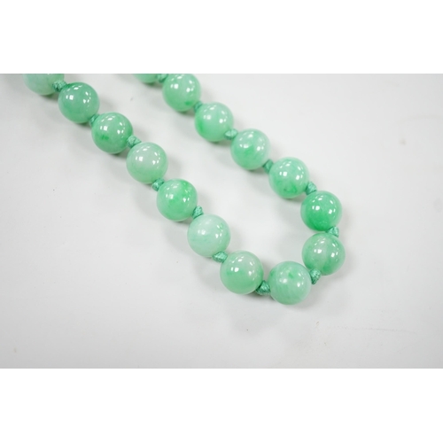 994 - A single strand jade bead necklace, 58cm, gross weight 91 grams.