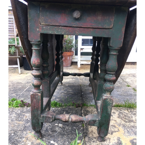 105 - An 18th century oak gateleg dining table, the turned underframe with traces of old paint, length 123... 