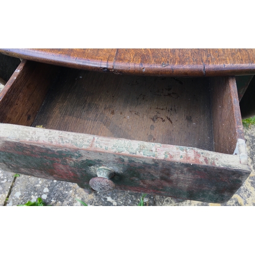 105 - An 18th century oak gateleg dining table, the turned underframe with traces of old paint, length 123... 