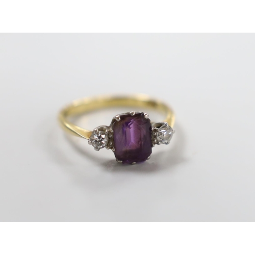 998 - An 18ct, single stone amethyst and two stone diamond set ring, size N, gross weight 3 grams.