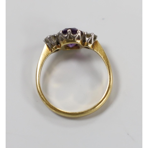 998 - An 18ct, single stone amethyst and two stone diamond set ring, size N, gross weight 3 grams.