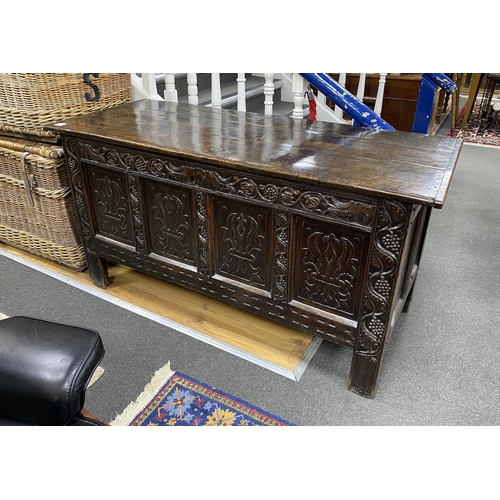 181 - A Charles II carved oak chest, c.1680, with three plank top and four panel front, width 150cm, depth... 