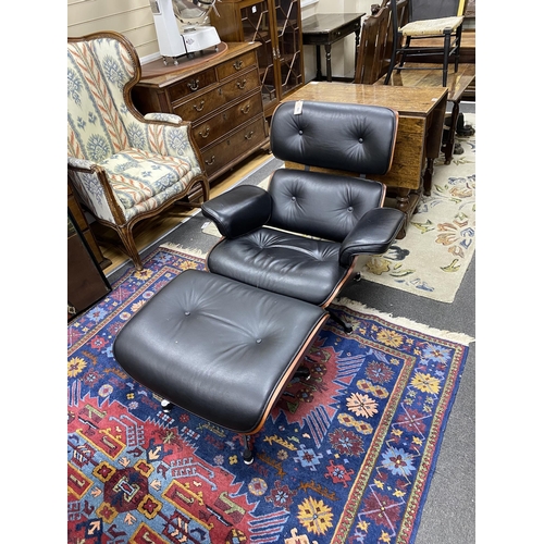 182 - An Eames style recliner armchair and footstool