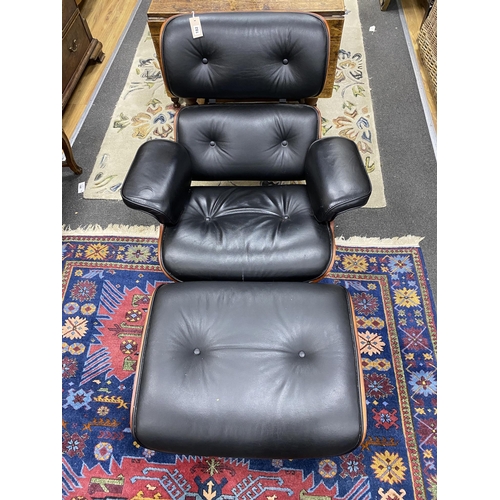 182 - An Eames style recliner armchair and footstool