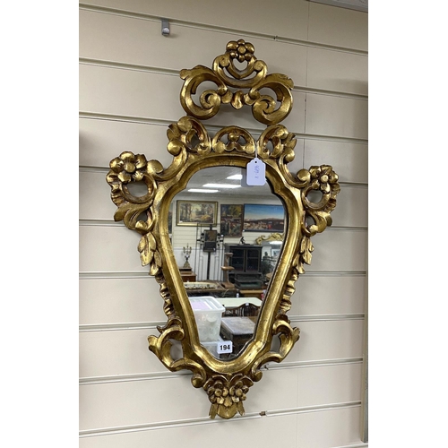 194 - A giltwood cartouche wall mirror, height 74cms.