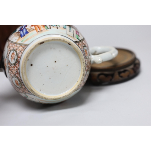 251 - An 18th century Chinese export famille rose teapot with later silver spout and cover, on hardwood st... 