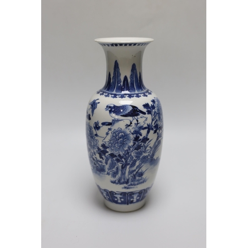 260 - A 19th century Chinese blue and white birds, rockwork and peonies vase, 26cm