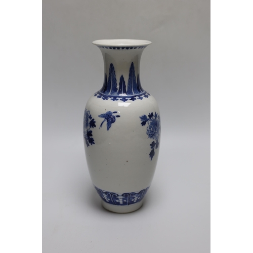 260 - A 19th century Chinese blue and white birds, rockwork and peonies vase, 26cm