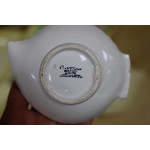 277 - A collection of Carlton Ware leaf moulded dishes, a cup and a preserve pot and cover