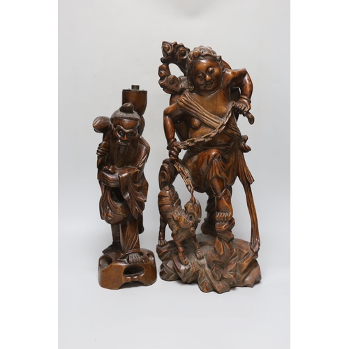 278 - An early 20th century Chinese hardwood figure of Liu Hai, and a similar figure of Shou Lao (2), tall... 