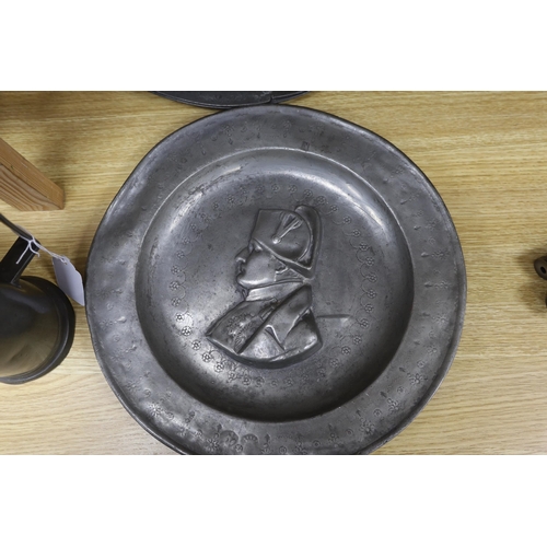 286 - Three 18th century French pewter flagons and chargers, largest 39cm diameter
