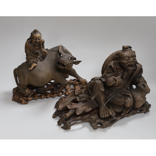 287 - Two Chinese carved hardwood figure groups on stands, early 20th century, largest 30cm long