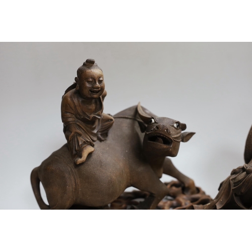 287 - Two Chinese carved hardwood figure groups on stands, early 20th century, largest 30cm long