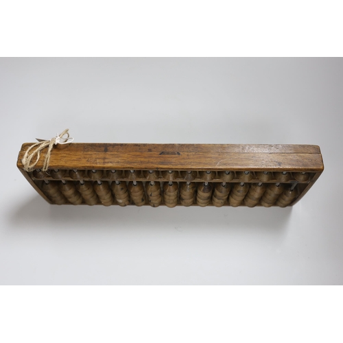 291 - A Chinese abacus, 34cm long