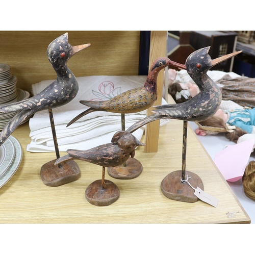 373 - Four various wooden folk art wild birds. Tallest 43cm