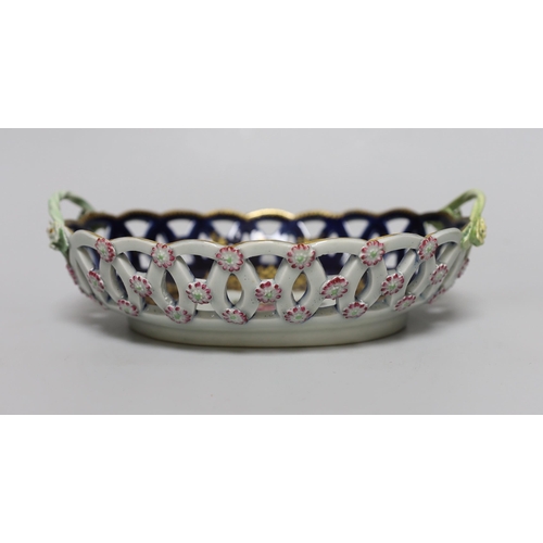 380 - A Worcester two handled basket with pierced sides painted with flowers, surrounded by rich and elabo... 