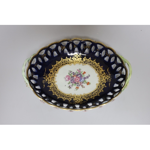 380 - A Worcester two handled basket with pierced sides painted with flowers, surrounded by rich and elabo... 