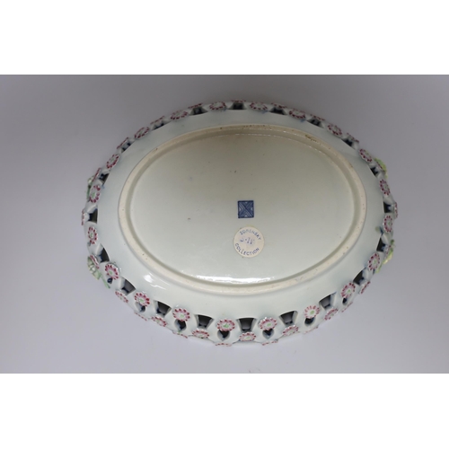380 - A Worcester two handled basket with pierced sides painted with flowers, surrounded by rich and elabo... 