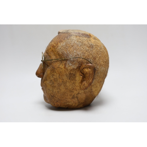 388 - A carved coconut head of a gentleman, 22cm tall