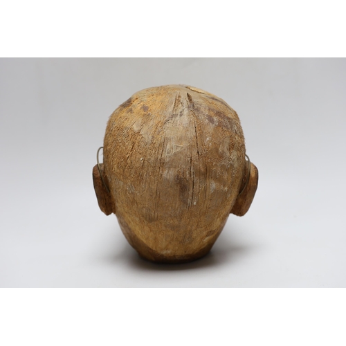 388 - A carved coconut head of a gentleman, 22cm tall