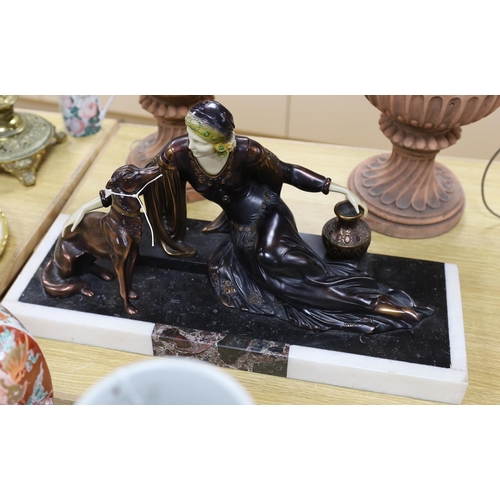 402 - An Art Deco style resin and marble figure group, length of base, 57cm